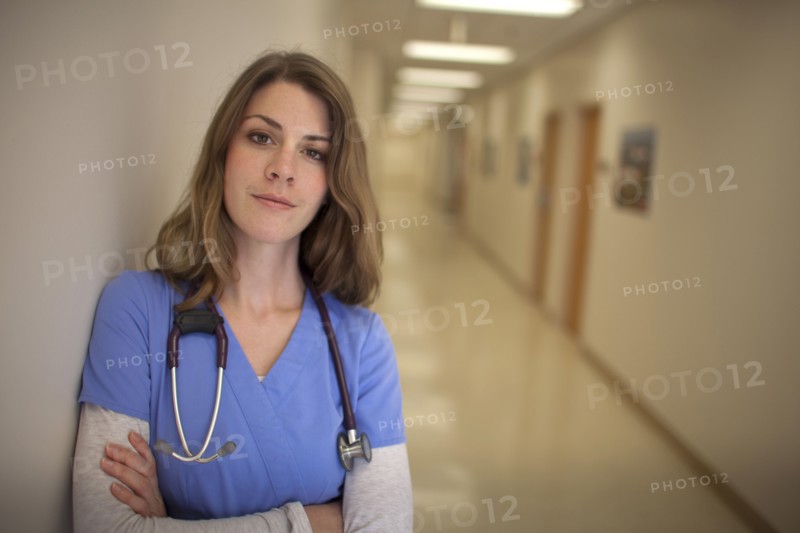 Caucasian nurse wearing stethoscope in hospital