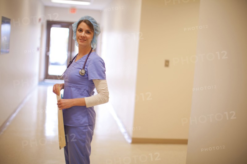 Caucasian nurse wearing hair net in hospital