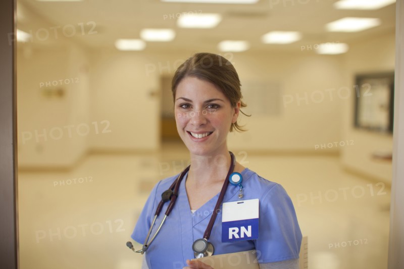 Caucasian nurse smiling in hospital