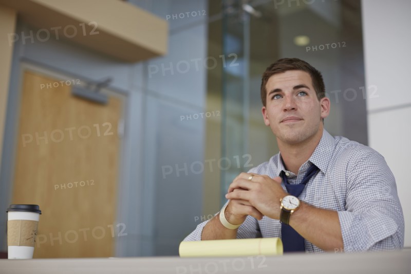 Caucasian businessman sitting in office