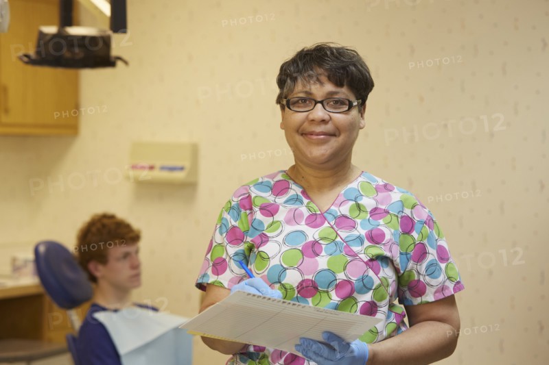 Pediatric dentist smiling in office