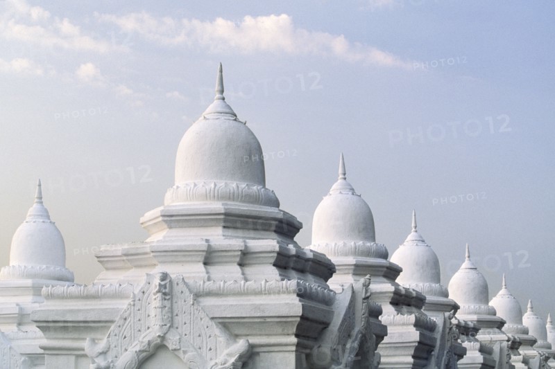 Ornate domes under cloudy sky