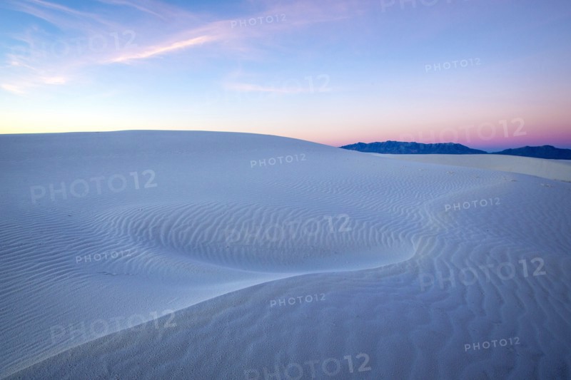 Sunrise over sand dunes