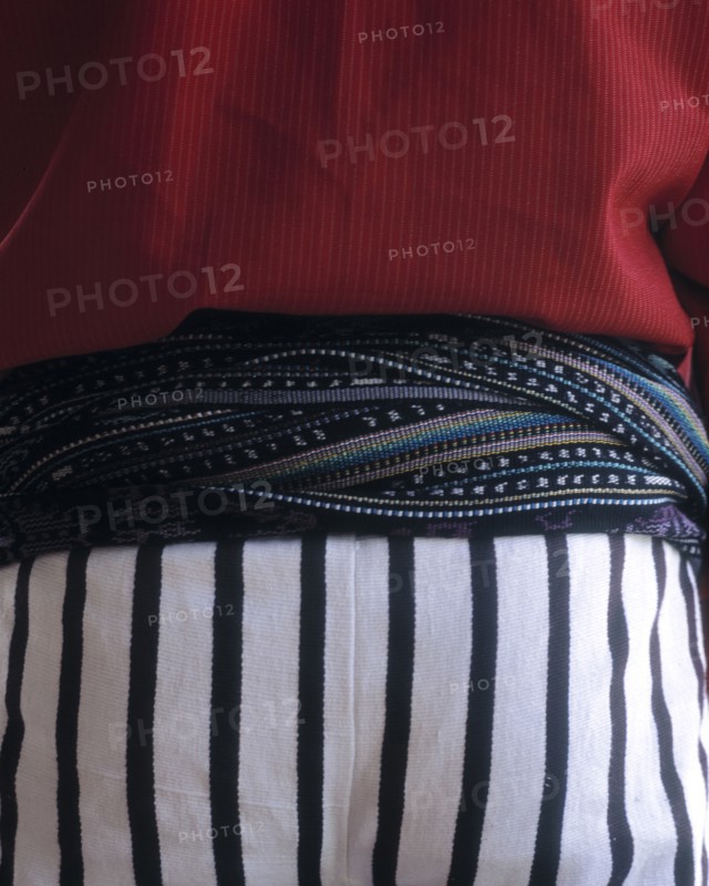 Close up of midsection of person wearing traditional clothing