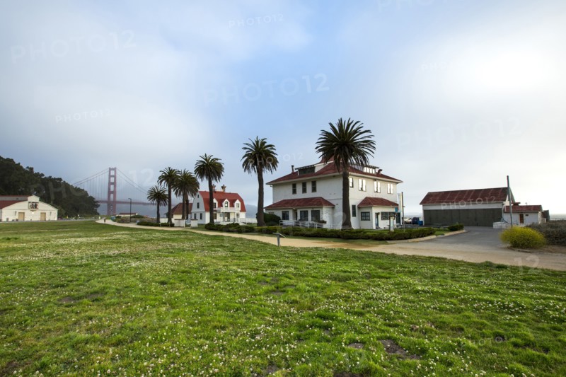 Houses and grass field near Golden Gate Bridge
