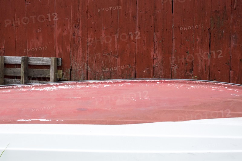 Rowboat stored upside-down at shack