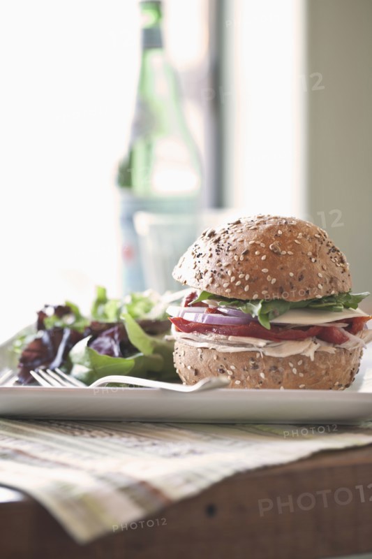 Sandwich and salad on plate