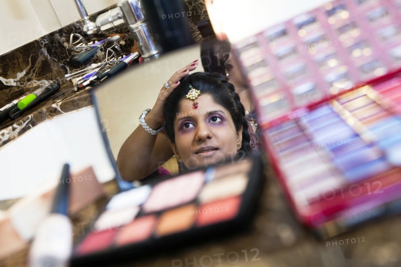Indian bride having makeup done