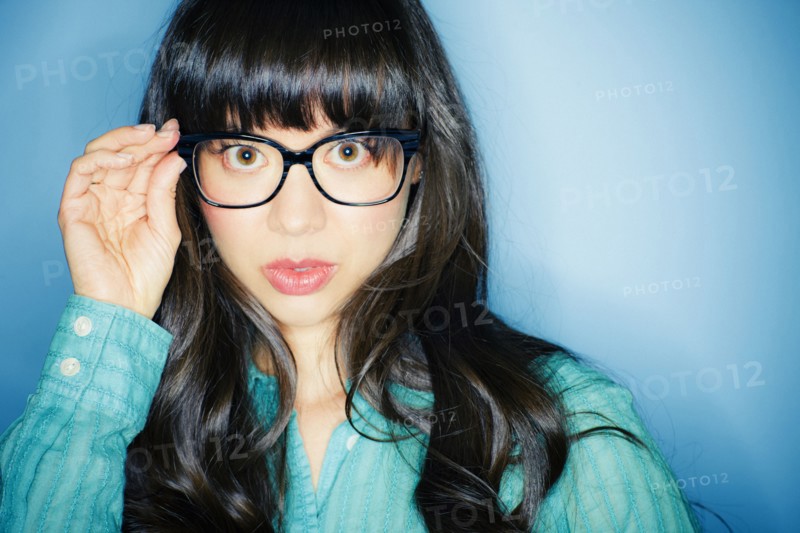 Serious mixed race woman in eyeglasses