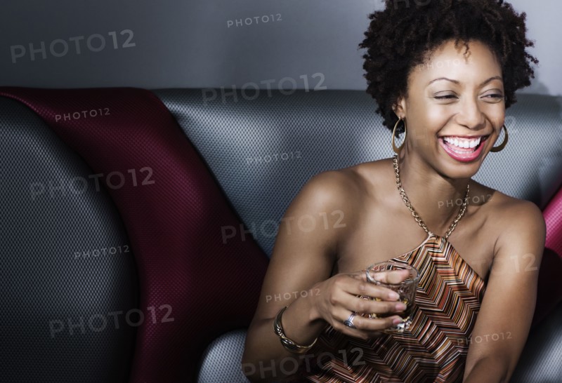 African American woman drinking in nightclub