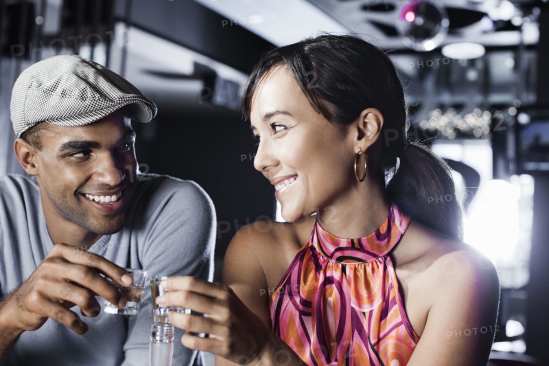 Couple toasting in nightclub