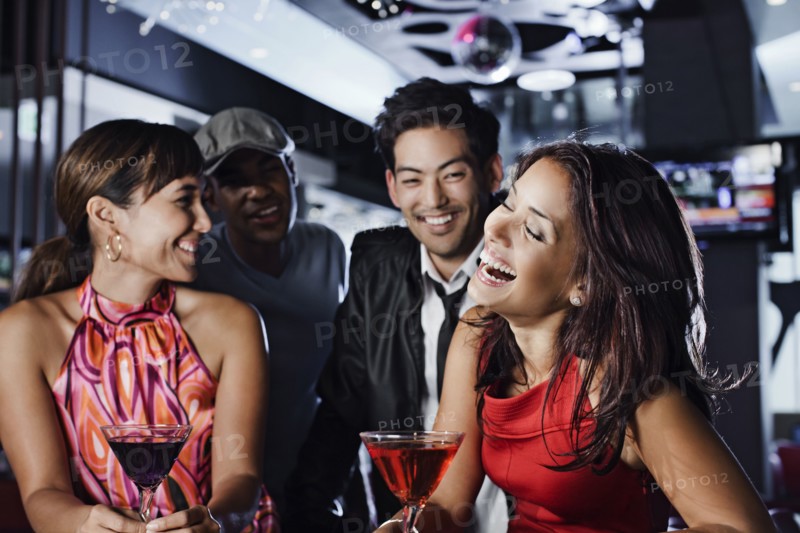 Friends drinking in nightclub