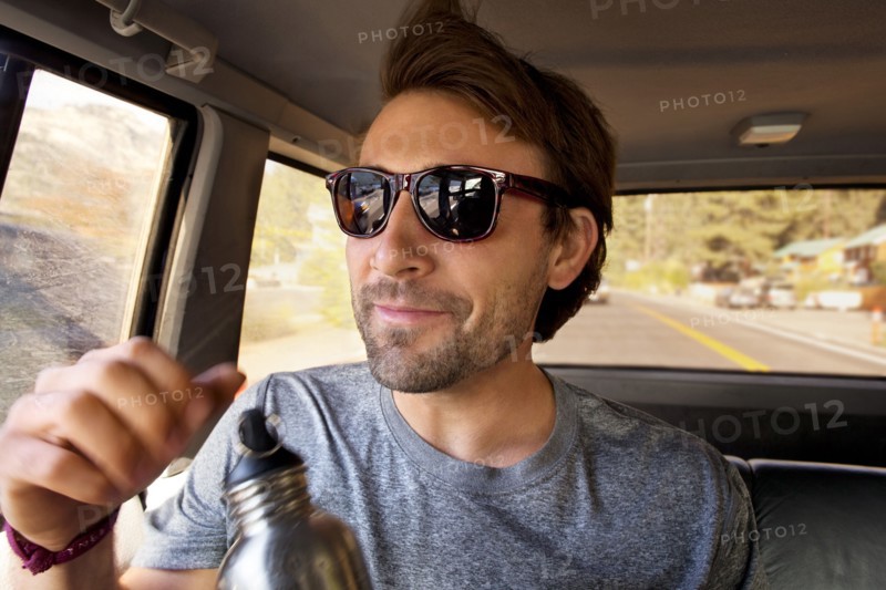 Man sitting in car