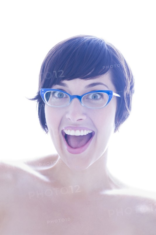 Portrait of surprised woman in eyeglasses