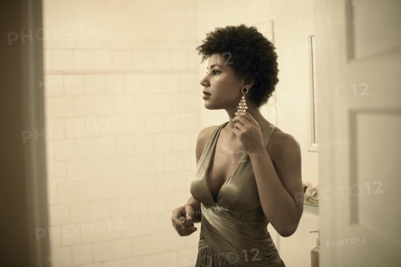 Woman getting ready in bathroom