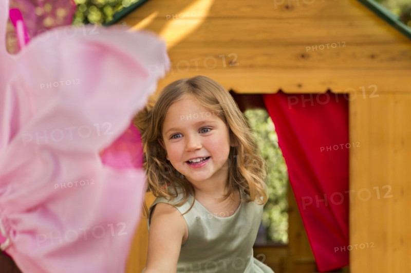 Smiling girl in playhouse