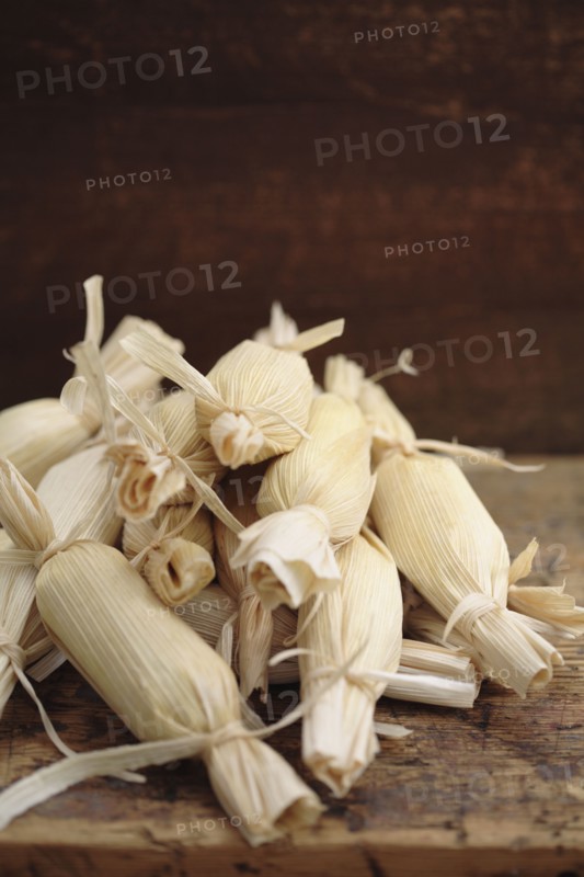 Stack of wrapped corn tamales