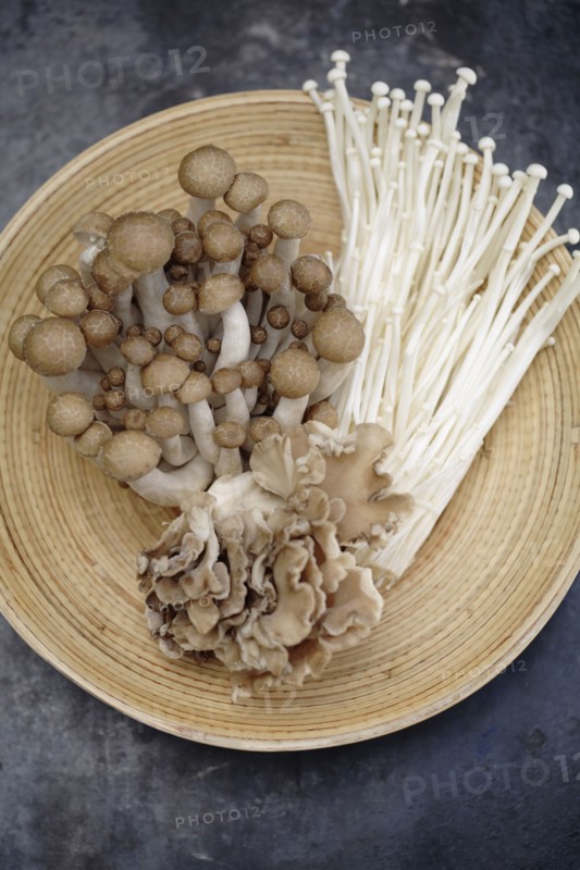 Variety of Asian mushrooms in basket