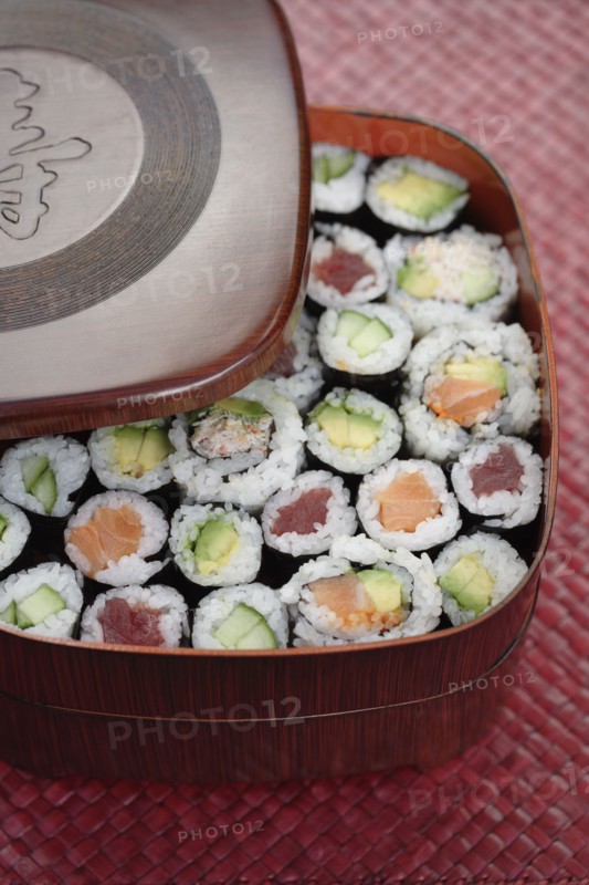 Variety of sushi rolls in box