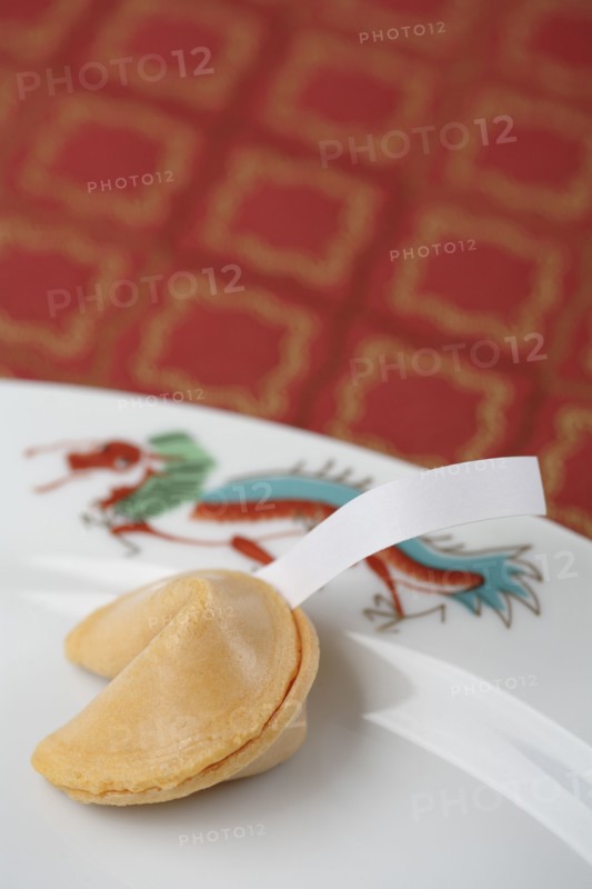 Close up of fortune cookie on plate