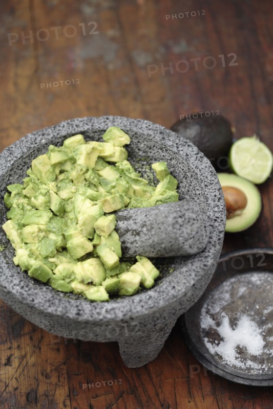 Guacamole in mortar with pestle