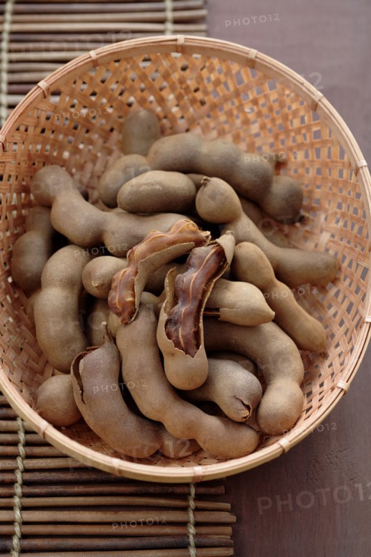 Tamarind pods in wicker basket