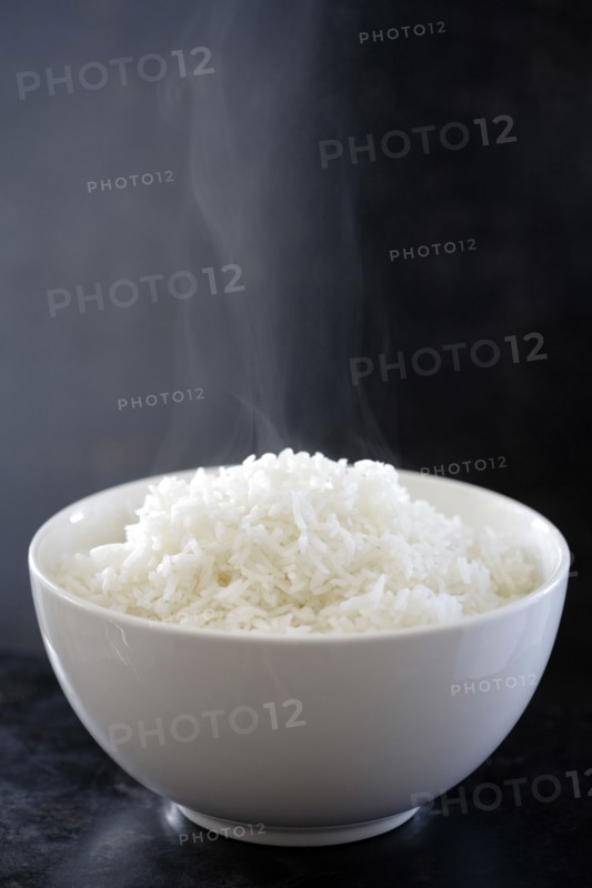 Steaming bowl of cooked rice