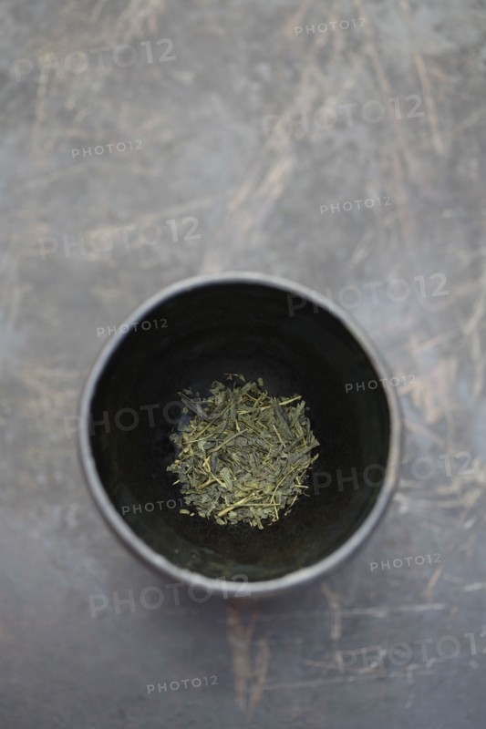 Dried sencha tea in tea cup