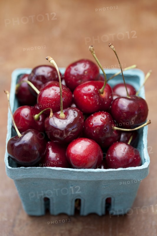 Close up of bing cherries in carton