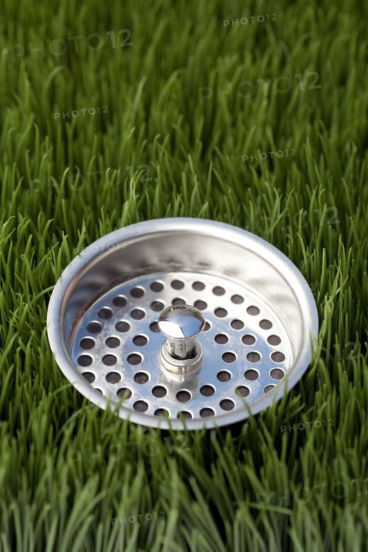Close up of sink strainer in grass