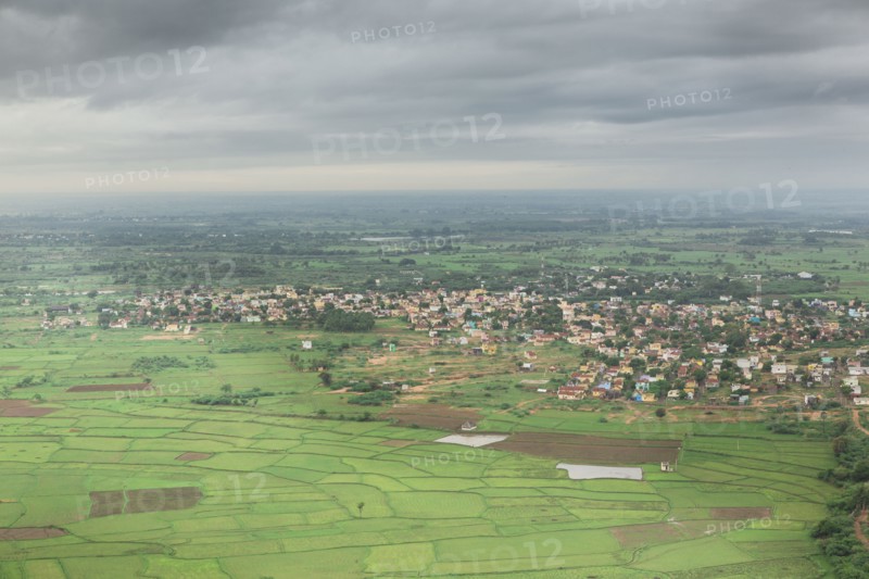 Clouds over village in rural landscape