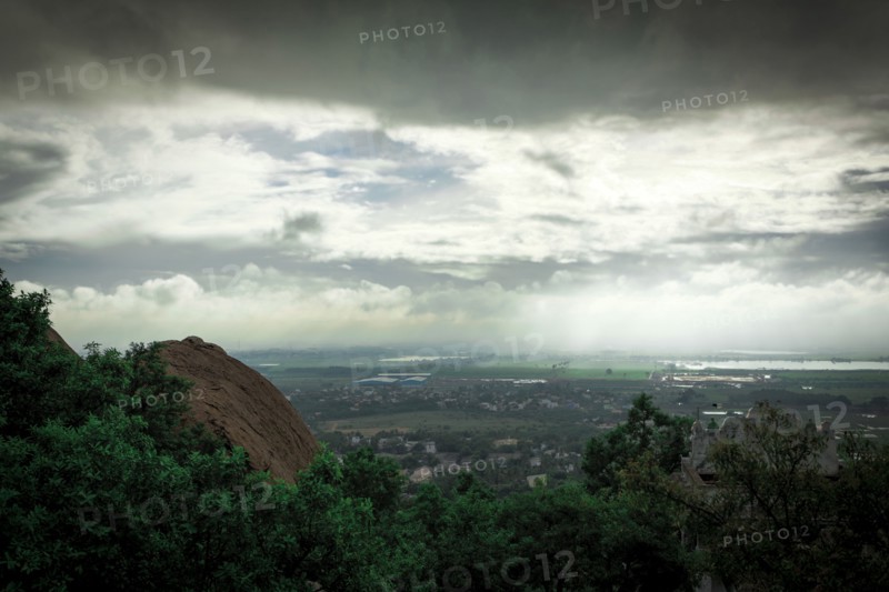 Storm clouds over treetops in rural landscape
