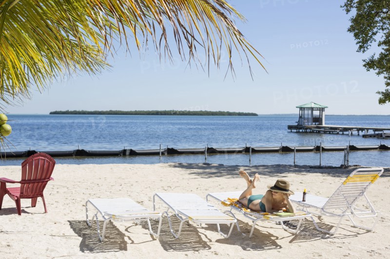Caucasian woman relaxing on tropical beach