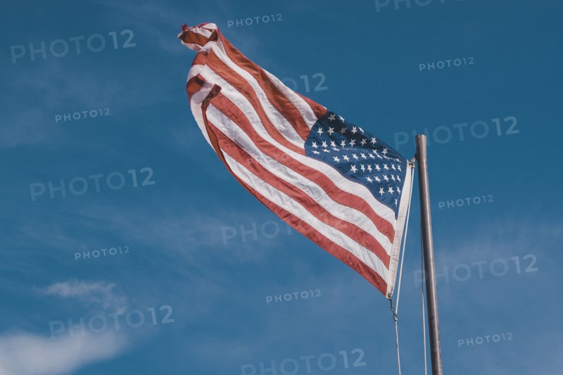 American flag under blue sky