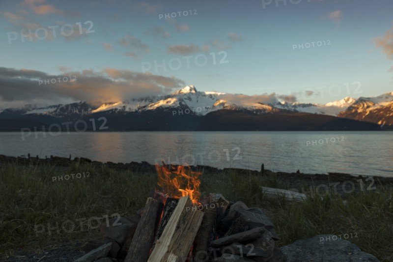 Campfire near mountain river