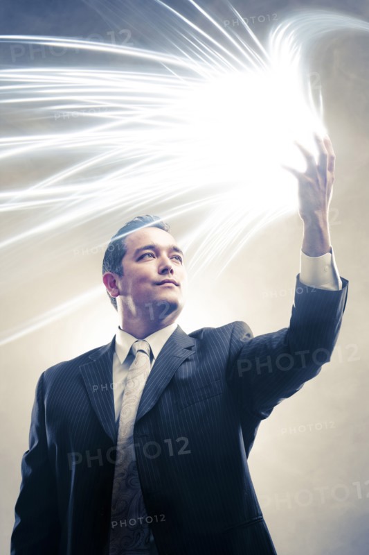 Light radiating from Japanese businessman's hands