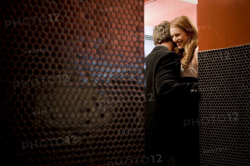 Couple kissing in bathroom