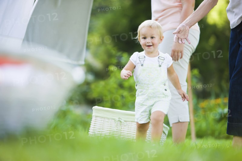 Caucasian baby running in grass