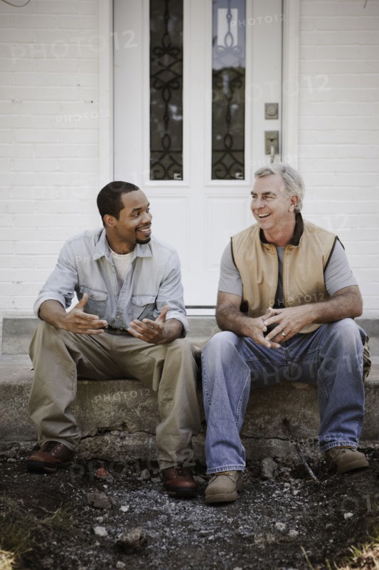 Carpenters sitting on front stoop