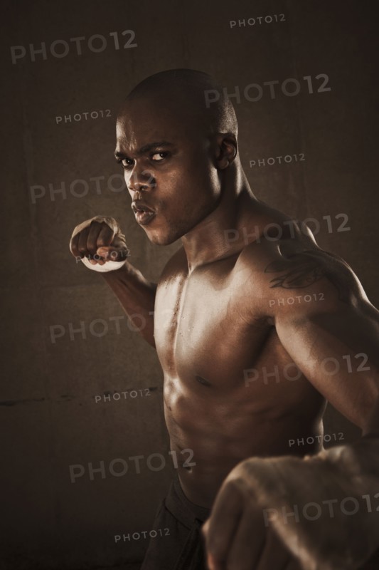 African American boxer preparing to punch