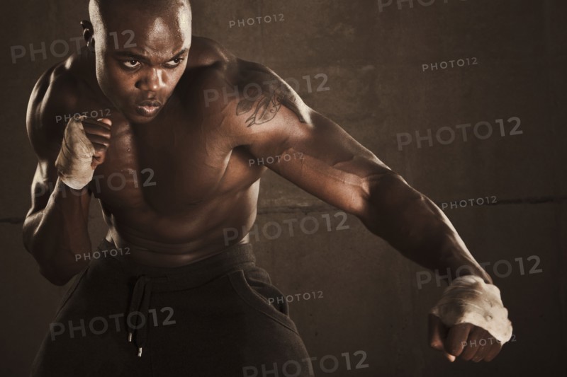 African American boxer preparing to punch