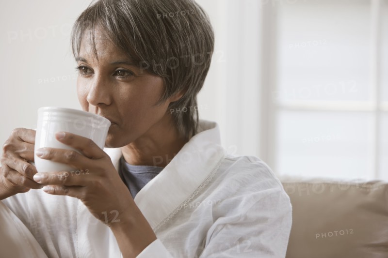 Native American woman drinking coffee
