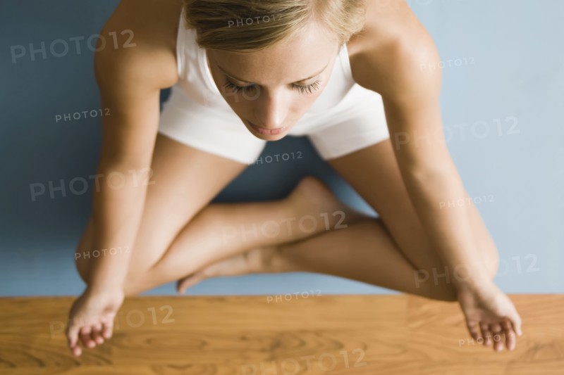 Caucasian woman practicing yoga