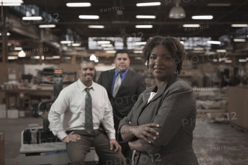 Business people standing in warehouse