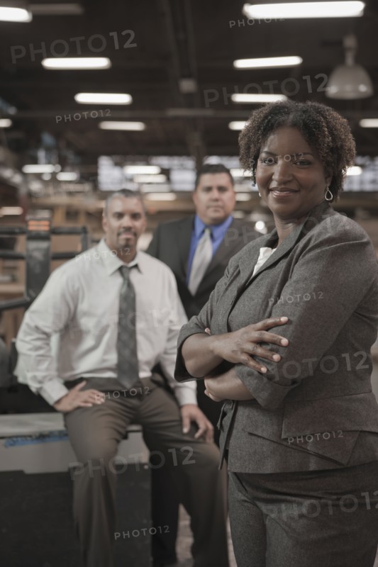 Business people standing in warehouse