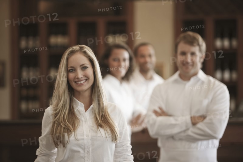 Wait staff standing in restaurant