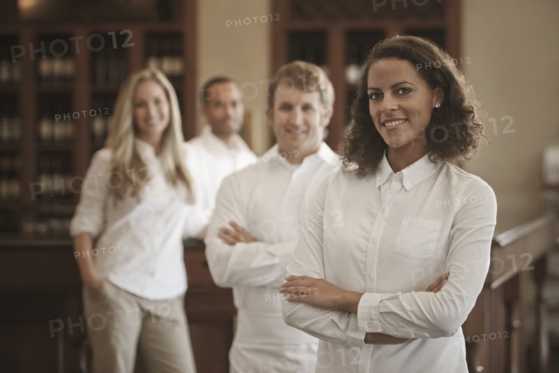 Wait staff standing in restaurant