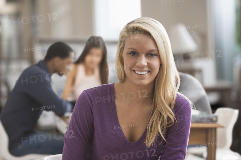 Caucasian woman studying with friends