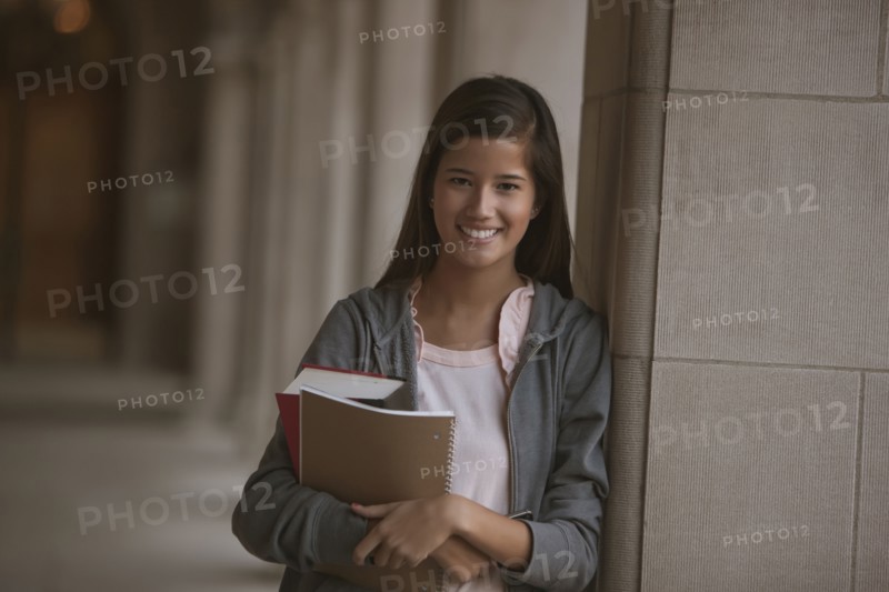 Smiling mixed race student on campus