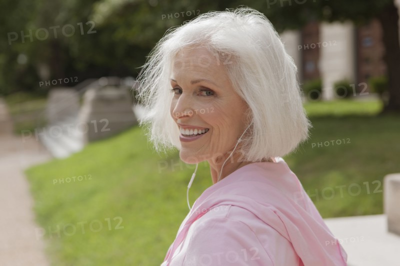 Caucasian woman listening to mp3 player